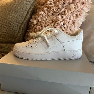 Brand new white Air Forces 1 LE. size 6y